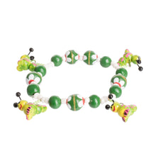 Load image into Gallery viewer, Handcrafted Ceramic Beaded Stretch Bracelet in Green - Merry Caterpillars | NOVICA