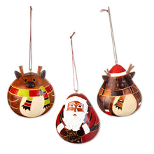 Load image into Gallery viewer, Peruvian Hand-painted Set of 3 Dried Gourd Holiday Ornaments - Santa and His Reindeer | NOVICA