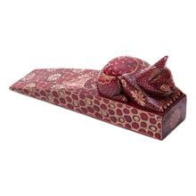 Load image into Gallery viewer, Handmade Batik Cat-Shaped Pule Wood Door Stop in Warm Hues - Feline Space | NOVICA
