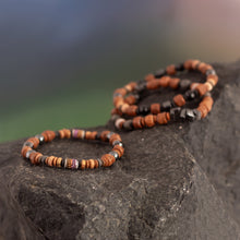 Load image into Gallery viewer, Onyx and Hematite Ceramic Beaded Stretch Bracelet from Peru - Andean Spirit | NOVICA