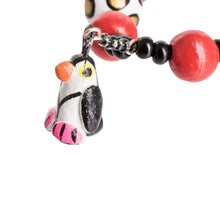Load image into Gallery viewer, Handcrafted Ceramic Beaded Stretch Bracelet with Penguins - Dangling Penguins | NOVICA