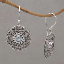 Load image into Gallery viewer, Blue Topaz and 925 Silver Circular Dangle Earrings from Bali - Mystic Shields | NOVICA