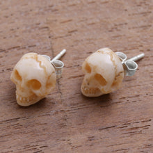 Load image into Gallery viewer, Hand-Carved Skull Bone Stud Earrings from Bali - Faces of Trunyan | NOVICA