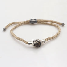 Load image into Gallery viewer, Bali Tiger's Eye & Sterling Silver Beige Cord Unity Bracelet - Silver Beige Handshake | NOVICA