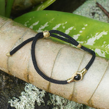 Load image into Gallery viewer, Brass and Black Obsidian Cord Unity Bracelet from Bali - Golden Handshake | NOVICA