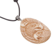 Load image into Gallery viewer, Handcrafted Eagle-Themed Bone Pendant Necklace from Bali - Eagle Trio | NOVICA
