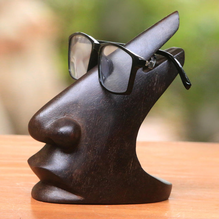 Wood Eyeglasses Stand in Dark Brown from Bali - Prominent Nose in Dark Brown | NOVICA