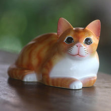 Load image into Gallery viewer, Signed Wood Sculpture of a Lying Cat in Orange from Bali - Lying Cat in Orange | NOVICA
