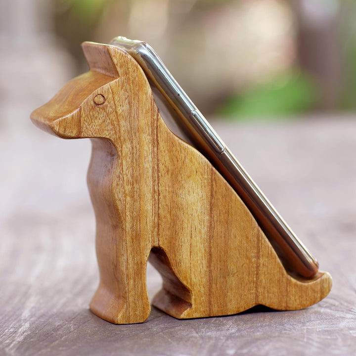 Hand Carved Jempinis Wood Phone Stand - Dialing Dog | NOVICA