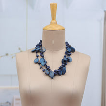 Load image into Gallery viewer, Hand-Carved Beaded Statement Necklace in Blue and Gold Hues - Bohemian Joy in Blue | NOVICA
