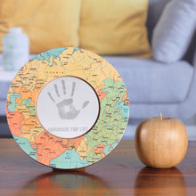 Load image into Gallery viewer, Laminated Wood 4-Inch Round Photo Frame with Map Motif - Colorful Cartography | NOVICA
