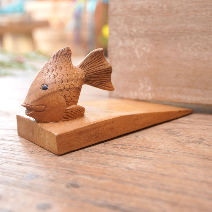 Handcrafted Suar Wood Fish Doorstop in Brown from Bali - Helpful Goldfish in Brown | NOVICA