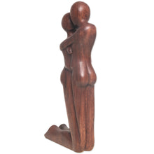 Load image into Gallery viewer, Hand Carved Romantic Suar Wood Statuette from Bali - Kneeling Embrace | NOVICA
