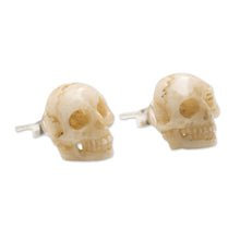 Load image into Gallery viewer, Hand-Carved Skull Bone Stud Earrings from Bali - Faces of Trunyan | NOVICA
